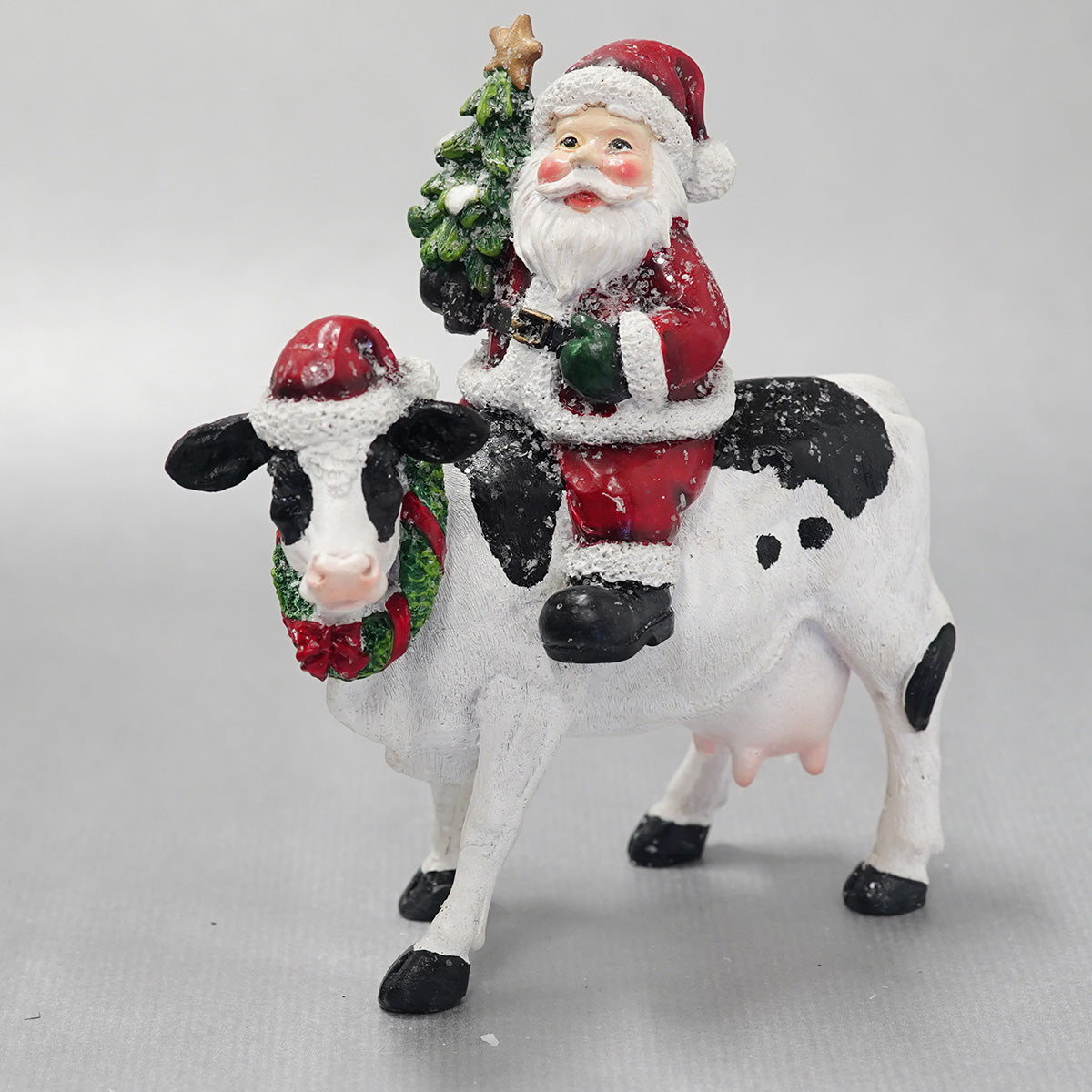 Santa Sitting on Cow 14.5x8.5x16cm
