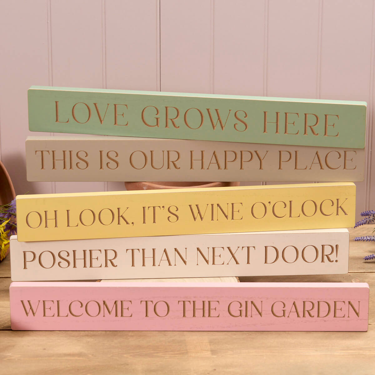 home wooden block different sayings Posher than next door, oh look it’s wine o clock, this is our happy place, love grows here