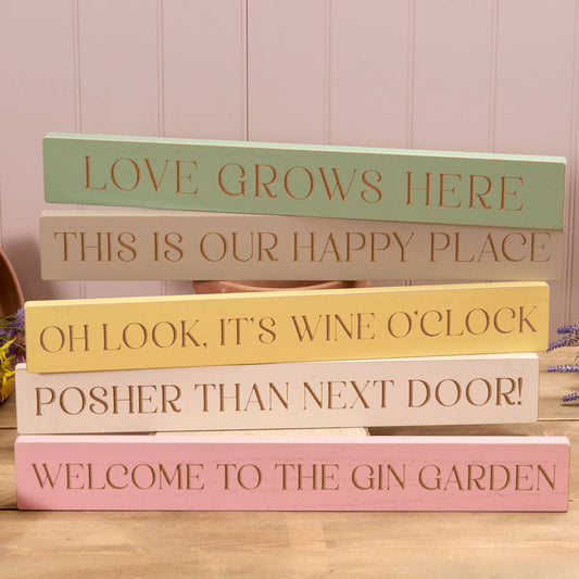 home wooden block different sayings Posher than next door, oh look it’s wine o clock, this is our happy place, love grows here