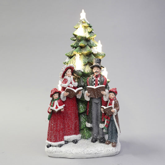 Carol singer family w/leds in tree 15.5x14.5x32.2cm