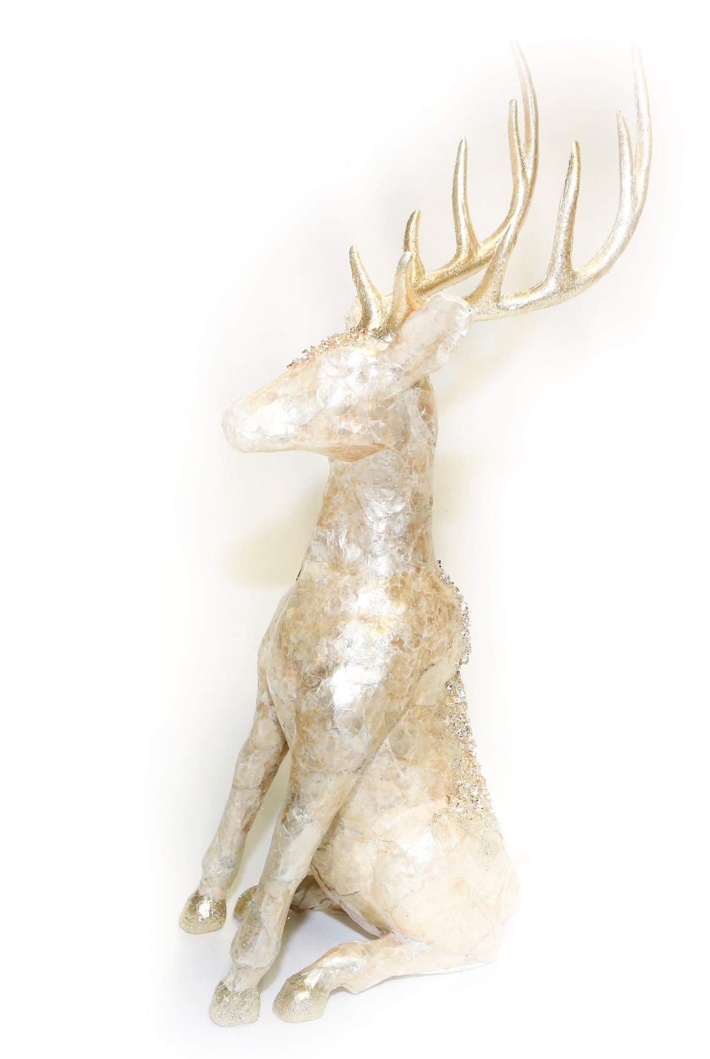 Gold coloured sitting reindeers
