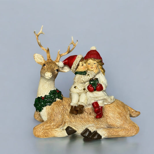Christmas kids sitting on reindeer 24.5x7x14cm